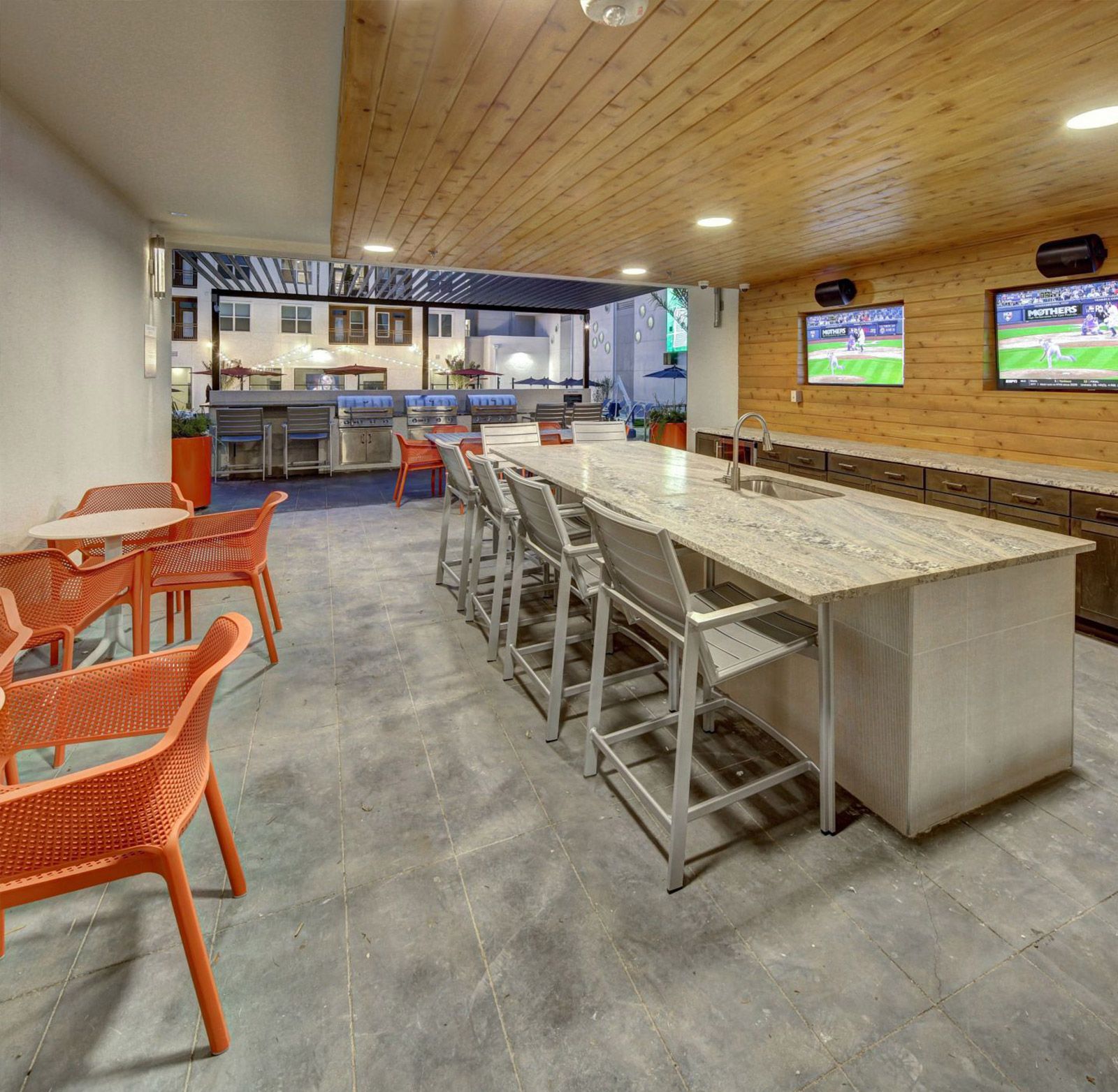 covered bar and grilling area with TVs San Marcos student housing