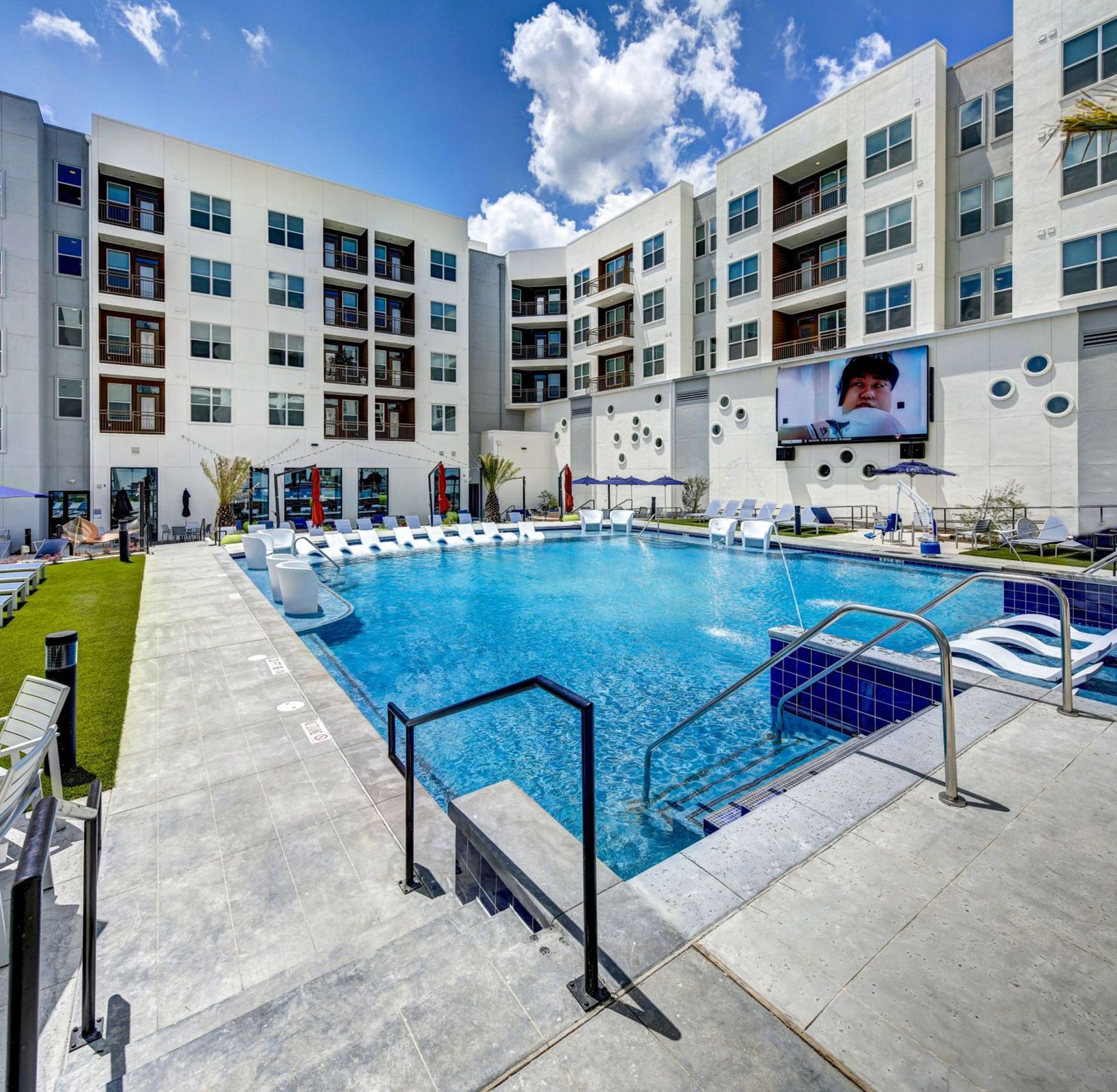 poolside with jumbotron San Marcos student housing